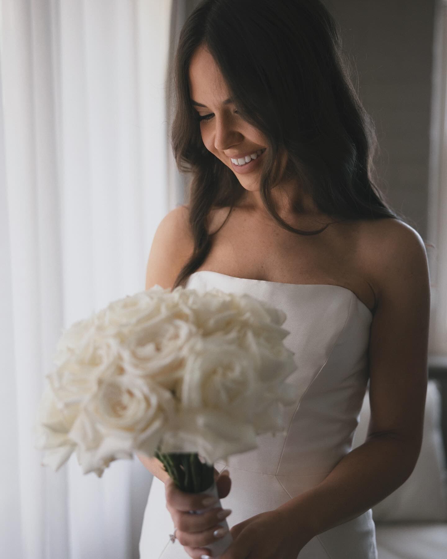 Detail of a long-stem white rose bridal bouquet photographed at Mandalay House and Garden